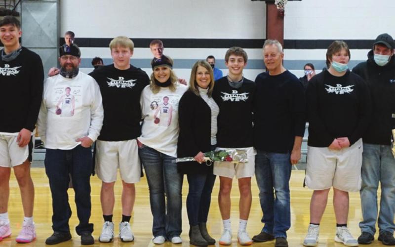 Pictured left to right are the Titans Boys Basketball Senior players and their parents: Sophia Swanson, Alex Swanson, Bart Swanson, Lindsay Pollestad, Gage Pollestad, Jeremy Kartes, Caleb Kartes, Mary Kartes, Kristi Johnson, Sam Johnson, Lynn Johnson, Joey Bjornson, Marvin Bjornson, Les Backer, Tyson Backer, and Martha Fedje. VNV Photo by Lyle Van Camp