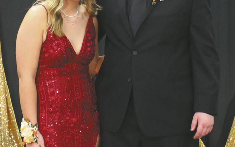Phoebe Stovel escorted by Johnny Osowski