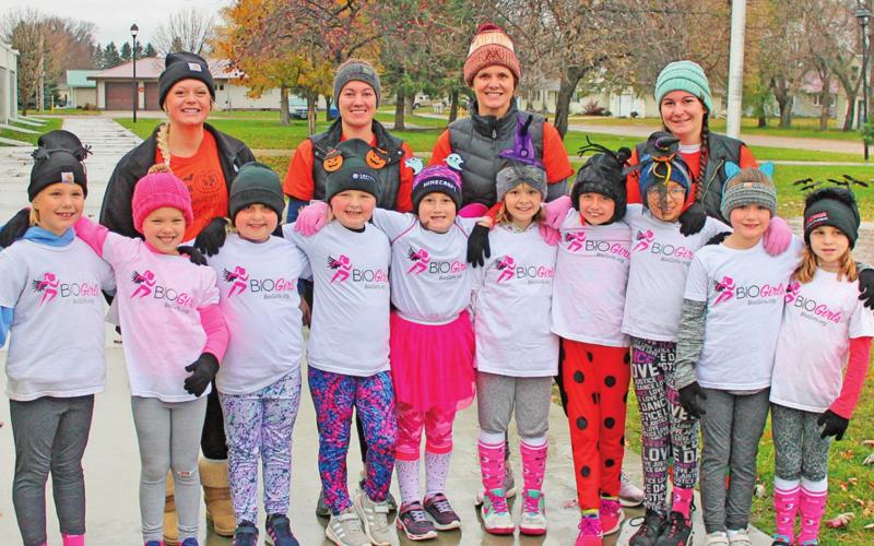 The BIO girls pose for a picture before starting their 5K run. Pictured left to right are: front row Shea Aasand, Evie Hillier, Molly Grundstrom, Marissa Grundstrom, Paige Tunks, Lana Kalka, Ruthie Rarick, Hailey Ladouceur, Brynlee Christenson, and Natalie Helm. Back row: Katie Dahl, Stephanie Woinarowicz, Christie McFarland, and Maggie Vold. Photo submitted by Jamie Rarick