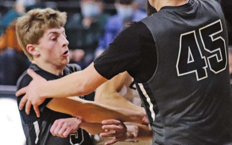Sam Johnson and Gage Pollestad double team a North Border Eagle to keep him from scoring in the Region II Tournament game Monday afternoon. VNV photo by Lesa Van Camp