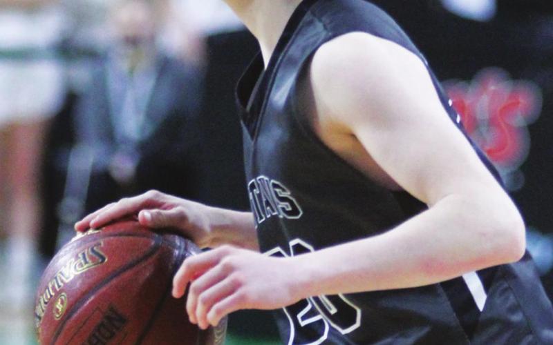Lucas Anderson looks for an open team mate late in the game against North Border Monday afternoon. VNV photo by Lyle Van Camp