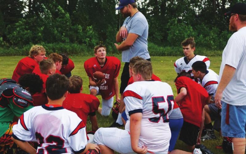 First year head coach Foster visits with the team after practice on Monday morning. VNV photo by Lyle Van Camp