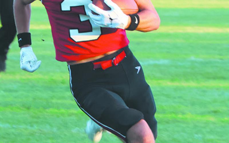 Trenten Keena breaks out for a long gain against White Shield. Photo by Lyle Van Camp