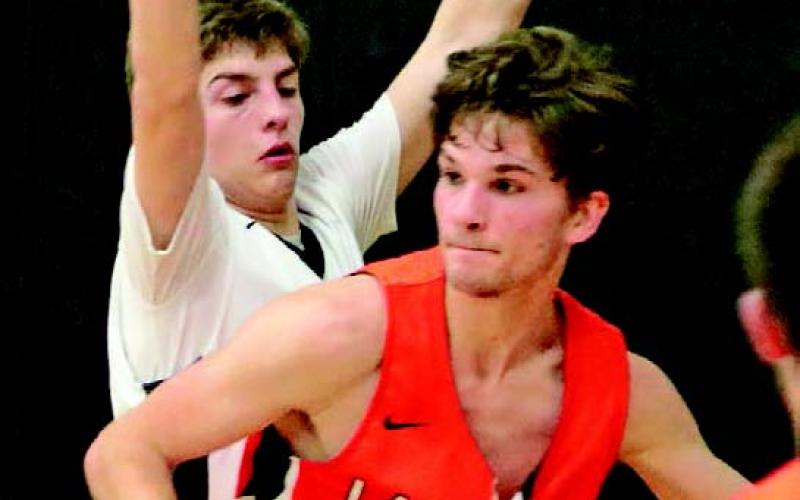 Sam Johnson guards against one of the Larimore players in the Drayton Gym last Tuesday. Photo submitted by Kerri Stegman, Drayton Public School
