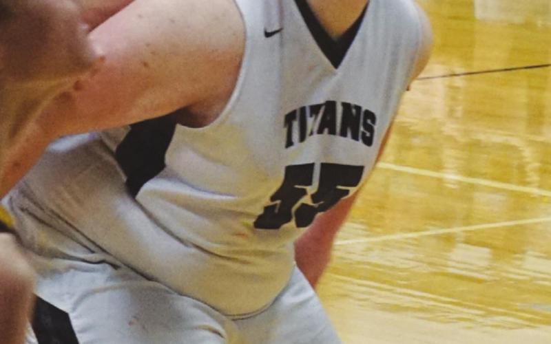 Joey Bjornson holds off two Park River defenders in action in Edinburg.