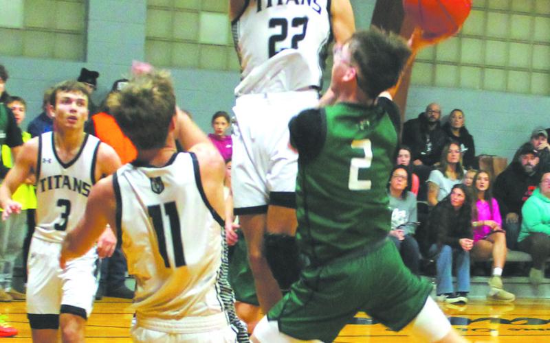 DVE's Carter Oberg comes down with the rebound. Photo by Jamie Rarick.