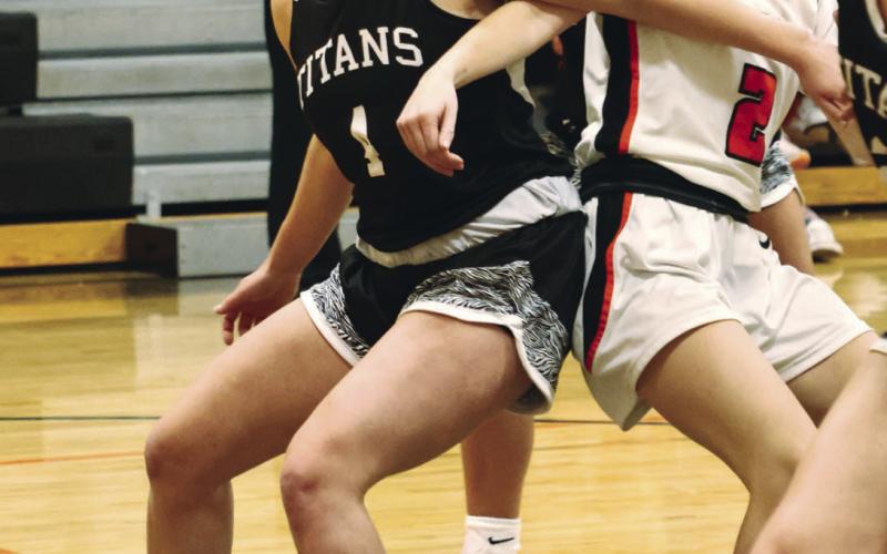 Greta Burrell fights for position on a rebound. Photo by Lyle Van Camp