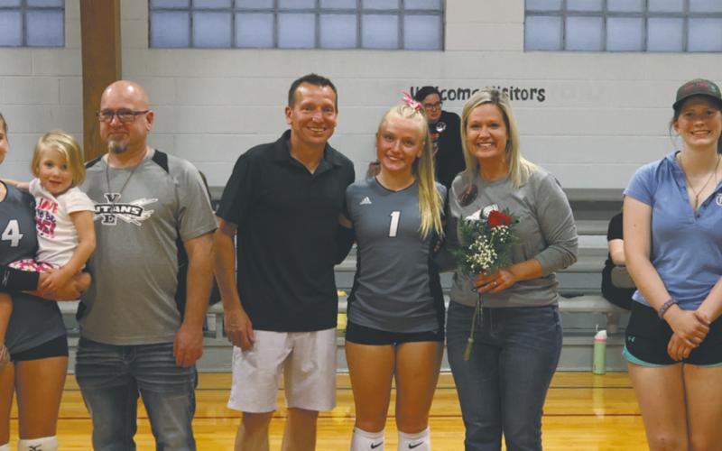 Greta Burrell, Reese Fering, and Hannah Myrdal with their parents on Parent’s night. Photo by Kerri Stegman