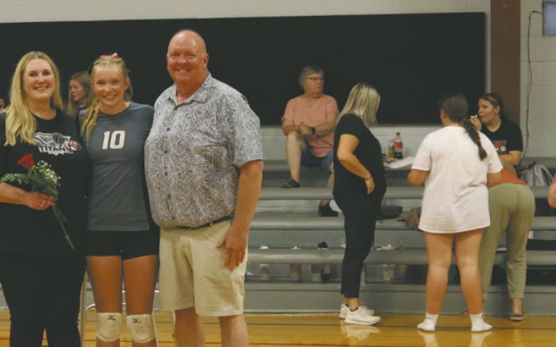 Aleah Pokrzywinski, Easton Larson and Emily Williams with their parents on Parent’s night. Photo by Kerri Stegman