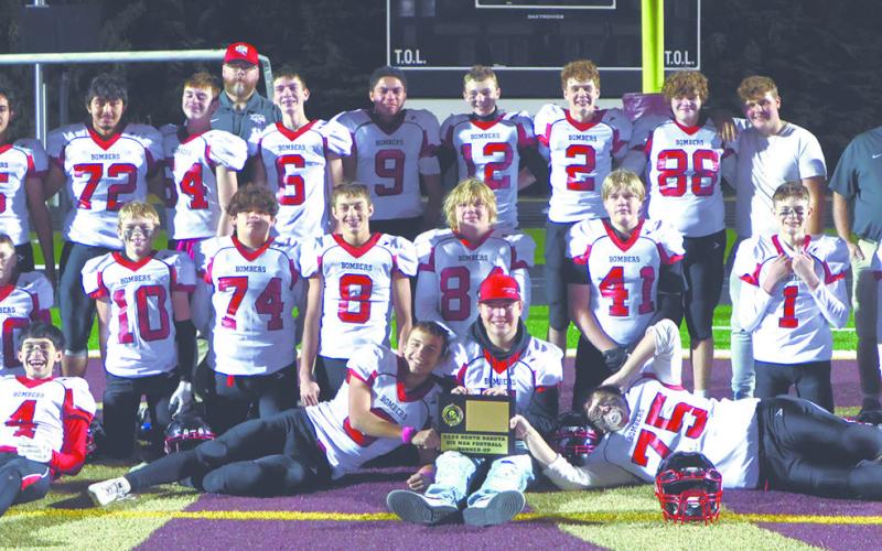 The Bombers gather for one last team photo after the championship game in Minot. Photo by Lyle Van Camp