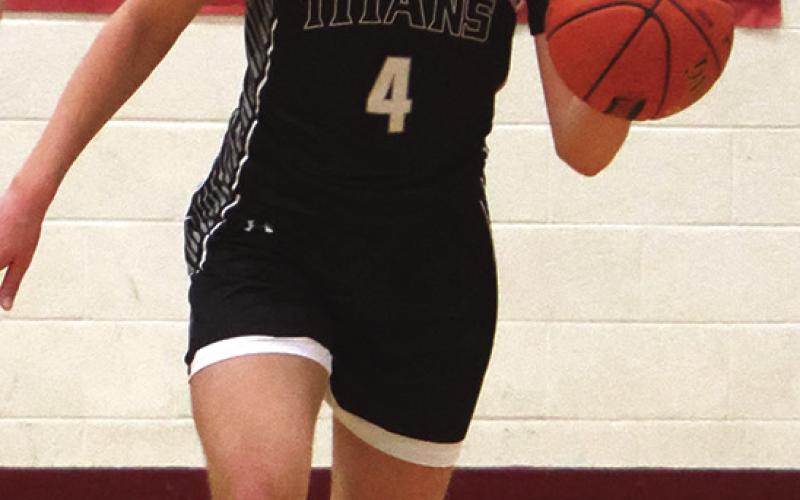Charlie Kittelson brings the ball up the court in action against North Star.