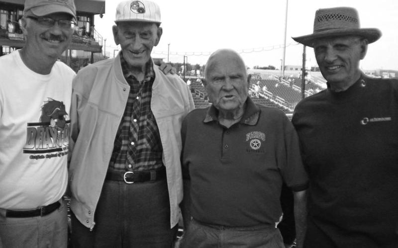 Bob Morris in his American Legion shirt with Robert Van Camp at the 2009 American Legion World Series in Fargo. Pictured left to right: Paul Van Camp, Robert Van Camp, Bob Morris, and Clinton Van Camp Photo submitted by Clint Van Camp