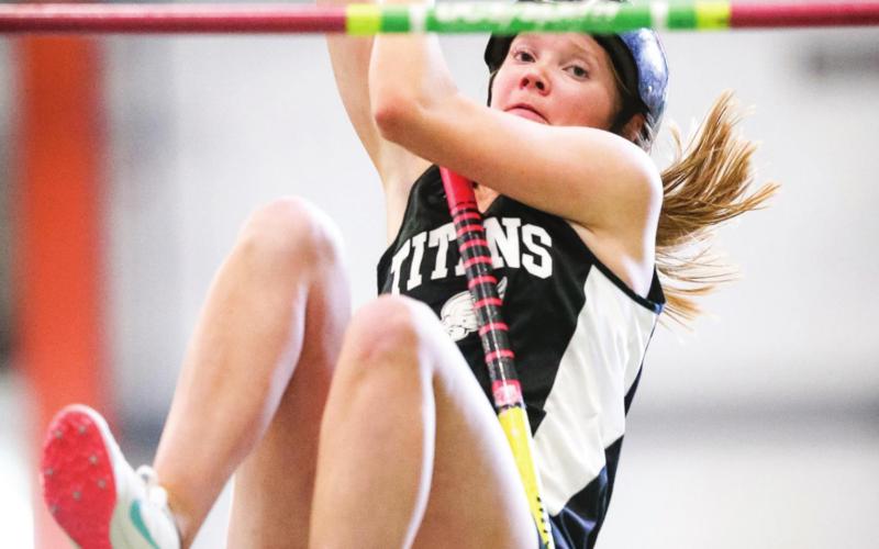 Easton Larson has her eye on the bar as she makes an attempt to clear in in the pole vault at UND. Photo by Cole Short courtesy of Hillsboro Banner