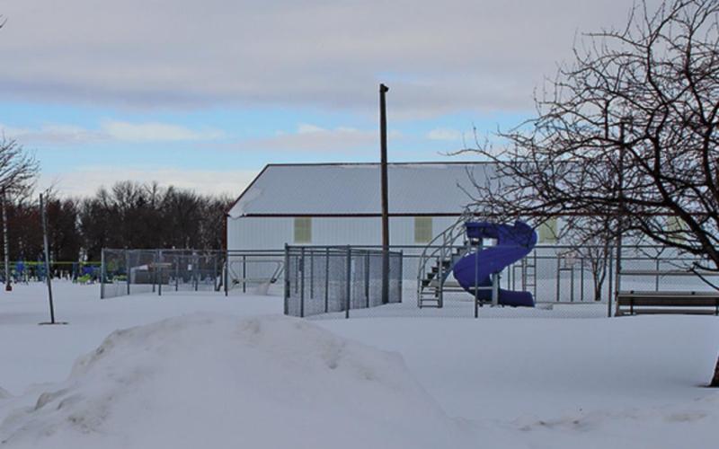 Schumacher park lies dormant many layers of snow just waiting for summer to arrive along with all the summer activities. VNV Photo by Lesa Van Camp