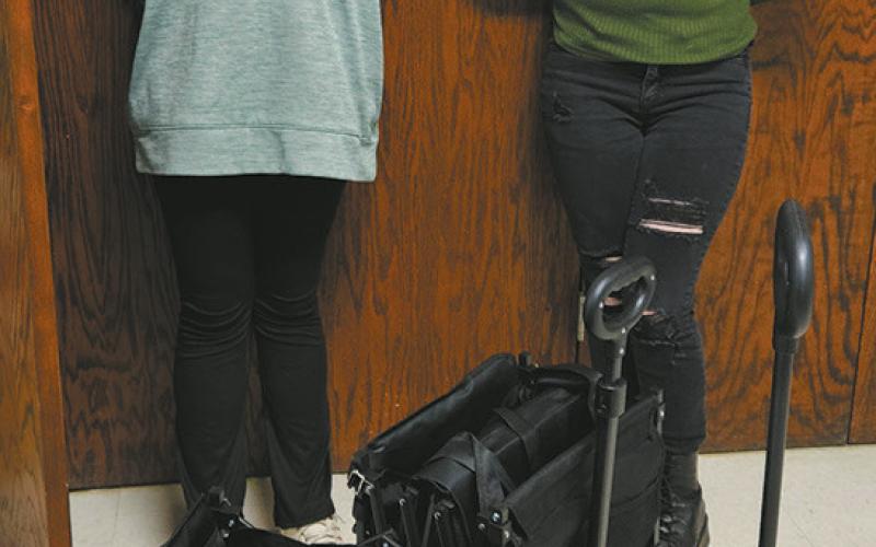 Natasha Shepard and Brooklynne Petersen pose with the carts purchased with grant funds. Photo by Shelly Quimby