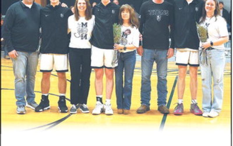 Together with their parents, DVE seniors Isaac Feltman, Frankie Duff, and Jack Langerud were recognized before Tuesday evening's game versus Park River in Crystal.  Photo by Jamie Rarick