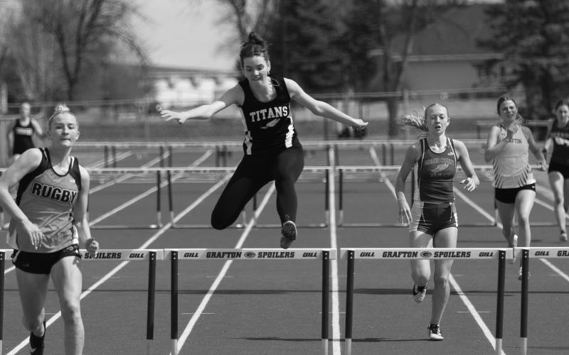 Elizabeth Fedje, center, placed sixth overall in the 100 meter high hurdles with a time of 18:39.