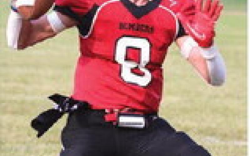 Gavin Ryan looks for an open receiver. Photo by Lyle Van Camp.