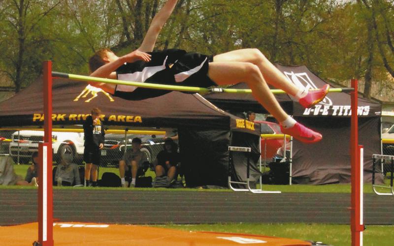 DVE junior Jack Langerud wins mens high jump and secures a place in the state competition as he clears 6' 2'. Photo by Jamie Rarick