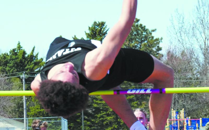Mason Pollestad places first in the high jump. Photo by Larry Stokke.