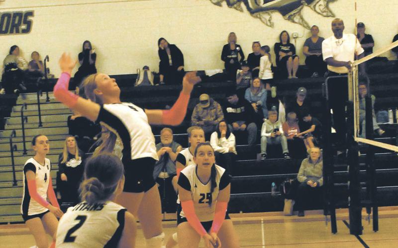 Winding up for the hit, DVE sophomore Peyton Larson jumps for the shot. Photo by Jamie Rarick