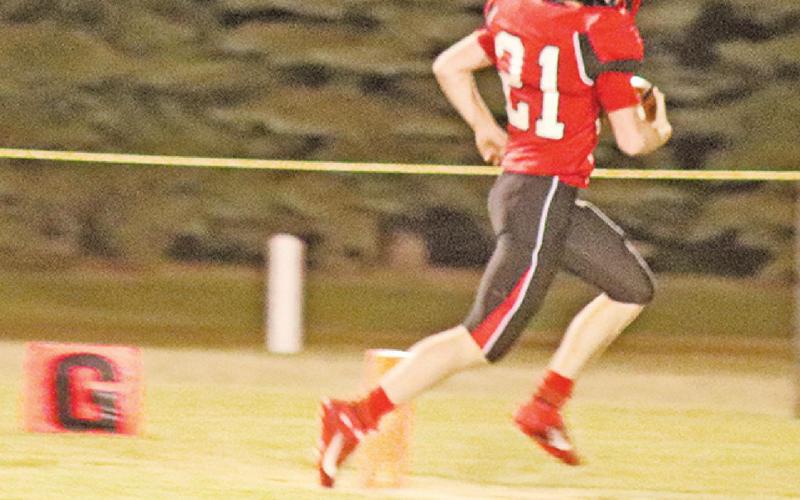 Cayden Quibell runs in the Bombers only touchdown late in the Homecoming game against Midway Minto last Friday night. VNV Photo by Lesa Van Camp