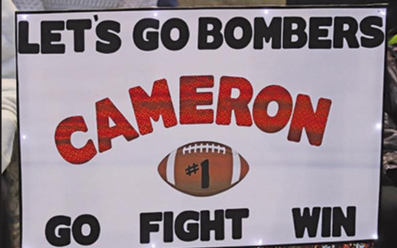 Pictured top: Cameron Walker’s family shows their support for the Bombers and their player during the homecoming game last friday night. VNV Photo by Lesa Van Camp