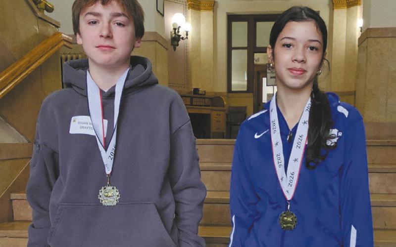 Drayton Students Rylan Nord and Angelina Carmo participate in the Pembina County Spelling Bee. Photo by Jamie Rarick