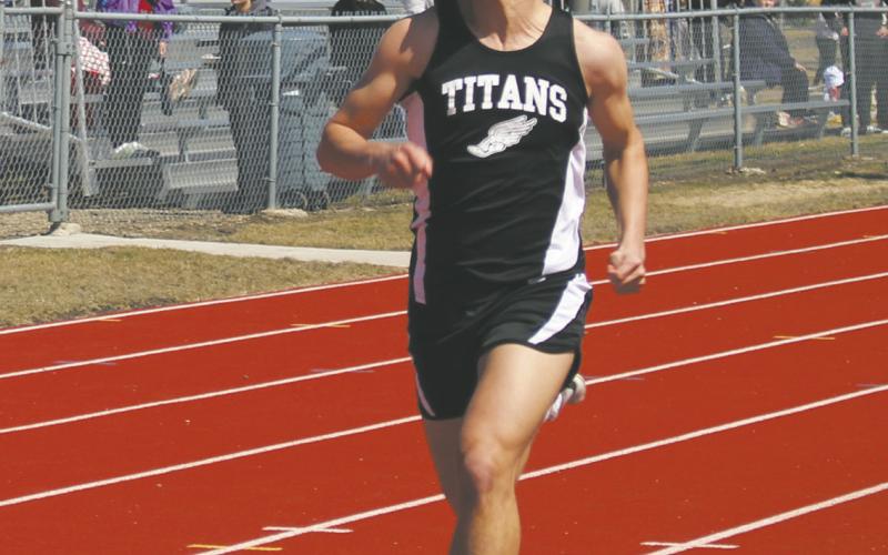 Carter Johnson eyes his competition over his shoulder while sprinting to the finish line during the 100 meter dash in the Grafton meet last week. Photo by Andrea Johnston