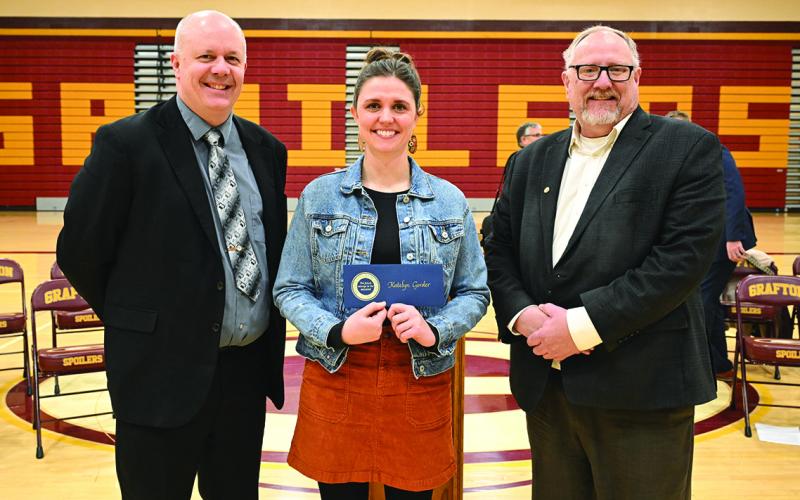 Randy Richards (left), policy director for U.S. Senator Kevin Cramer, and Tom Brusegaard (right), regional director for U.S. Senator John Hoeven, congratulate Milken Educator Award recipient Katelyn Gorder. Photo courtesy of the Milken Family Foundation.