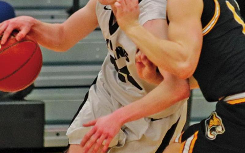 Lucas Anderson progresses the ball under intense defensive measures from Northern Cass last Tuesday night. VNV photo by Lesa Van Camp