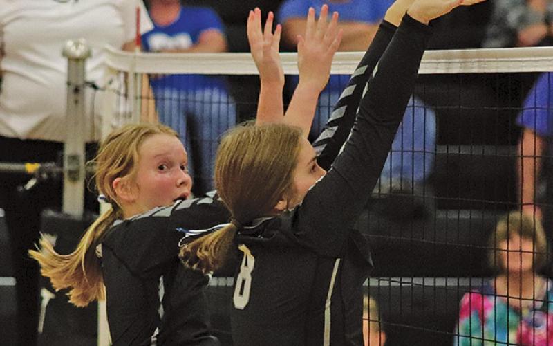 Easton Larson (l) and Kiara Aasand (r) go up for the block against the Hillsboro - Central Valley Burros last Thrusday night in the Drayton gym. VNV Photo by Lesa Van Camp