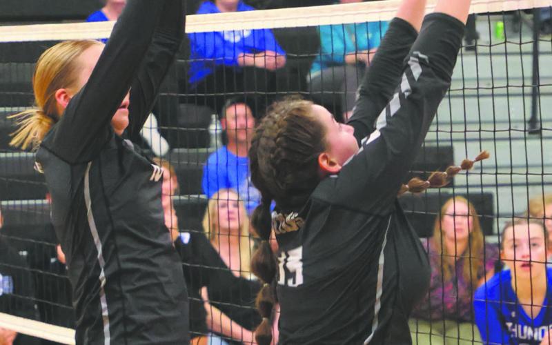 Easton Larson and Christine O’Toole go up for a block attempt in Drayton last week. Photo by Lyle Van Camp