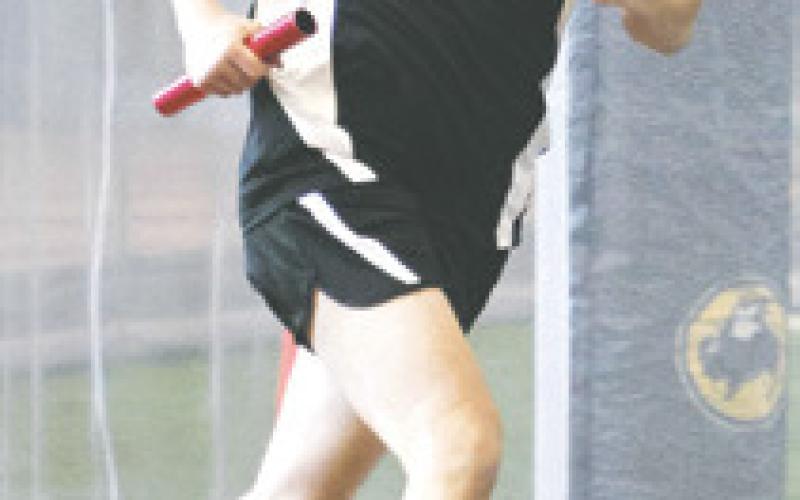 Daniel De Souza runs his leg of the boys’ 4 x 600 relay. Photo by Lyle Van Camp.