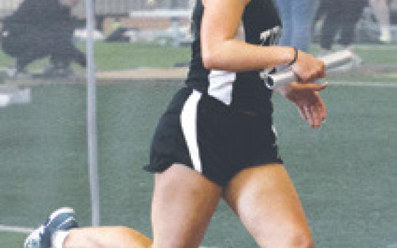 Reese Fering in the girls’ 4 x 300 relay. Photo by Lyle Van Camp.