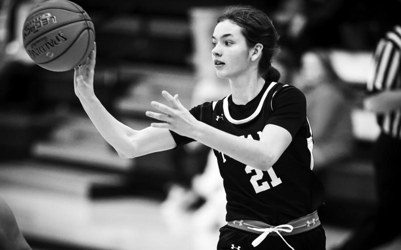 Elizabeth Fedje makes a pass at Hillsboro on Dec. 6. Photo by Cole Short - Hillsboro Banner.