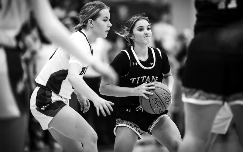 Jacey Nelson looks for an opening at Hillsboro on Dec. 6. Photo by Cole Short - Hillsboro Banner.