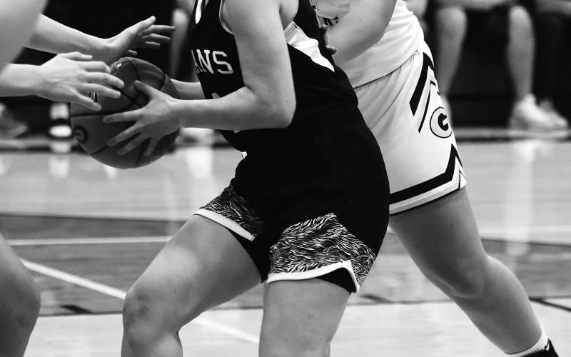 Greta Burrell is tied up by Grafton's stingy defense. Photo by Lyle Van Camp.