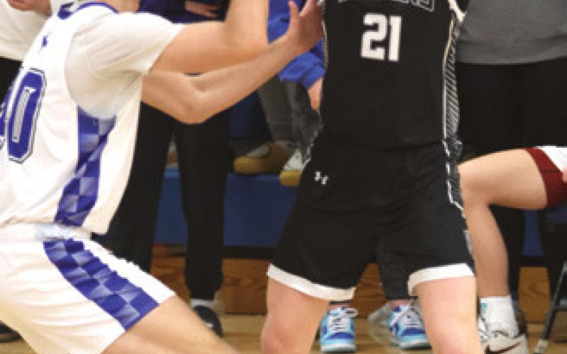 Cayden Quibell looks for an open teammate. Photo by Lyle Van Camp.