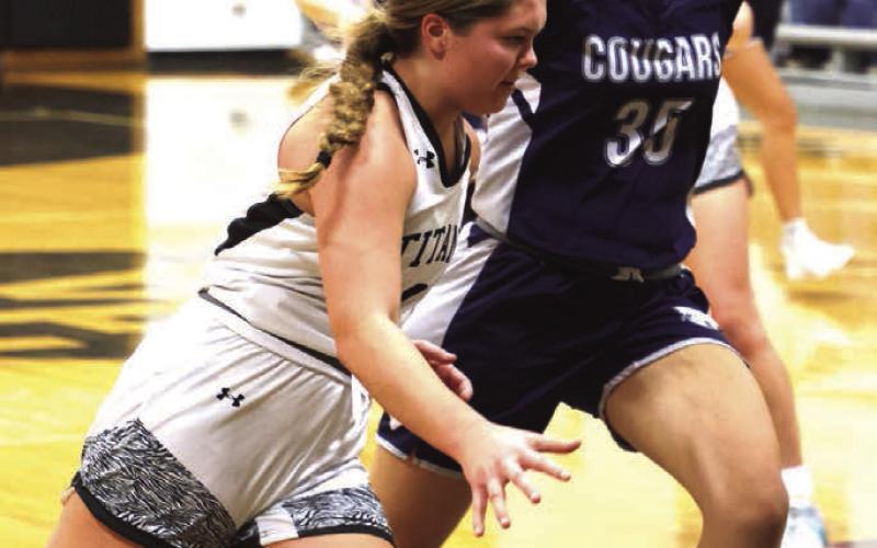 Brooke Gullickson drives past North Prairie's Morgan Casavant.