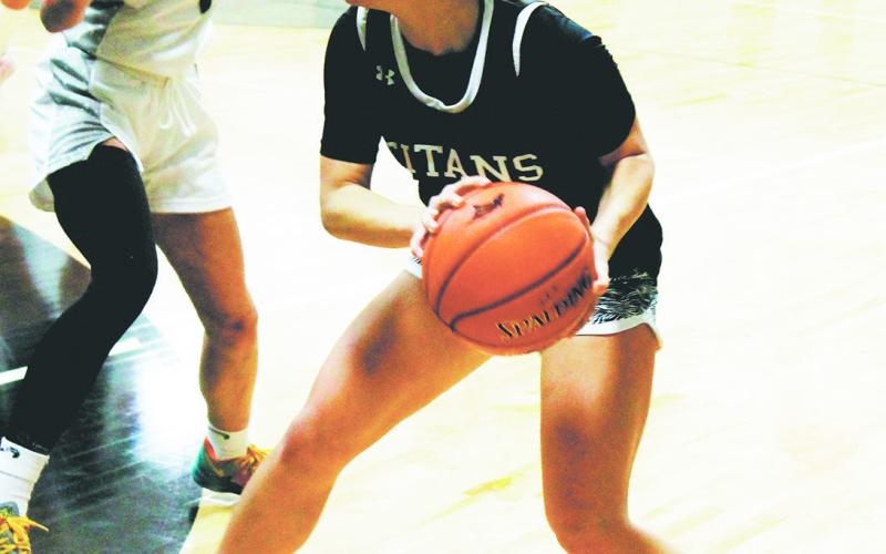 Reese Fering looks to move the ball past Charger defender Cara Sateren. Photo by Jamie Rarick