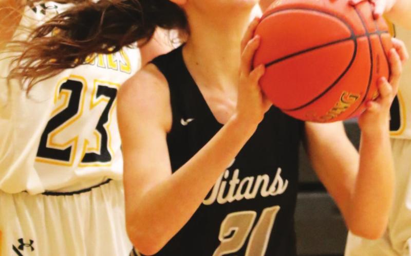 Elizabeth Fedje tries to shoot through two Park River defenders. VNV photo by Lyle Van Camp