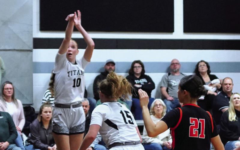 Easton Larson goes up for the shot at their play in game. Photo by Larry Stokke.