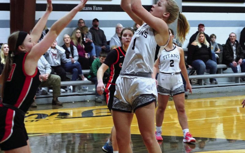 Alyssa Hoyles goes for a basket. Photo by Larry Stokke.