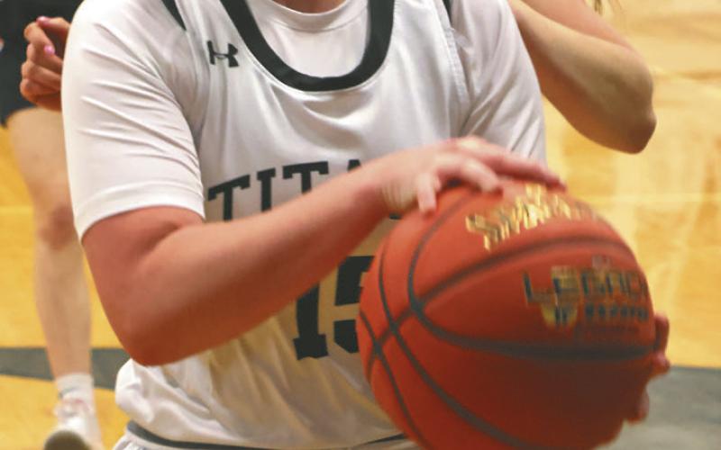 Aleah Pokrzywinski drives the lane against the Tornadoes. Photo by Lyle Van Camp.