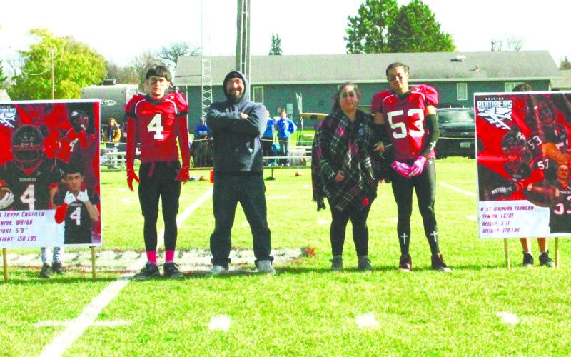 Bomber football seniors and their parents were recognized prior to Saturday's game. Pictured are seniors Trypp Castillo and Jerimiah Johnson with their parents. Photo by Jamie Rarick.
