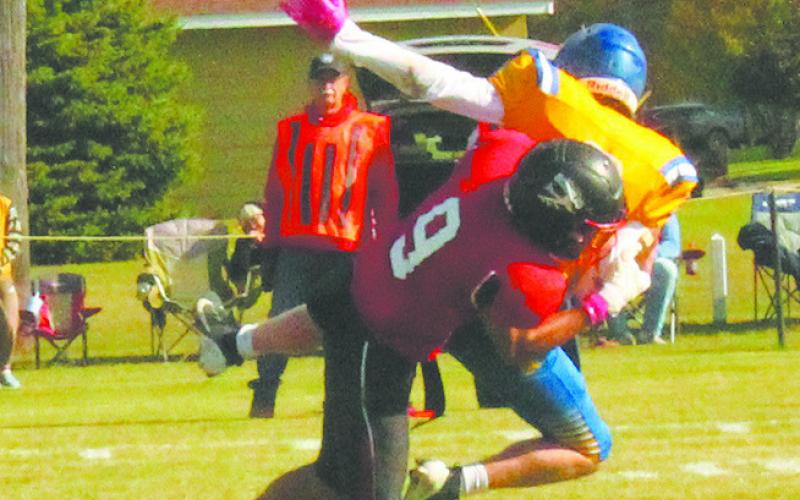 Mason Pollestad takes down the quarterback for a sack at Saturday's game. Photo by Jamie Rarick.