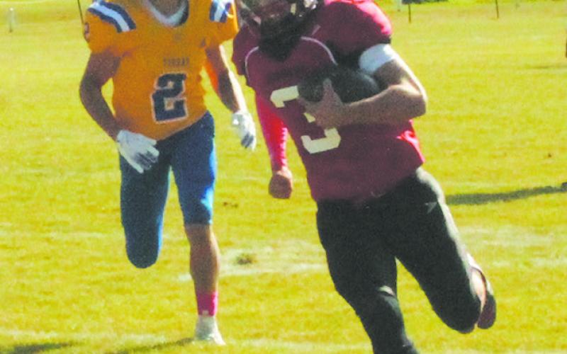 Trenten Keena runs the ball in for a Bomber touchdown. Photo by Jamie Rarick.