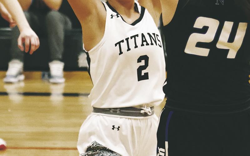 Brooke Gullickson defends Hatton-Northwood's Kennison Azure. Photo by Lyle Van Camp.