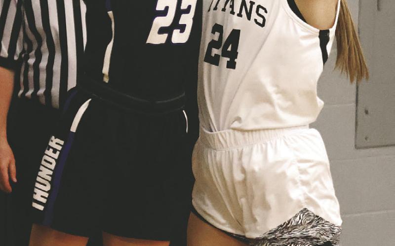 Kiara Assand attempts to shoot over Hatton-Northwood's Stella Serht. Photo by Lyle Van Camp.